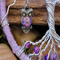 details of purple owl charm with clear glass eyes